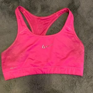 Cute worn out pink Nike sports bra. And also can fit like a Large.
